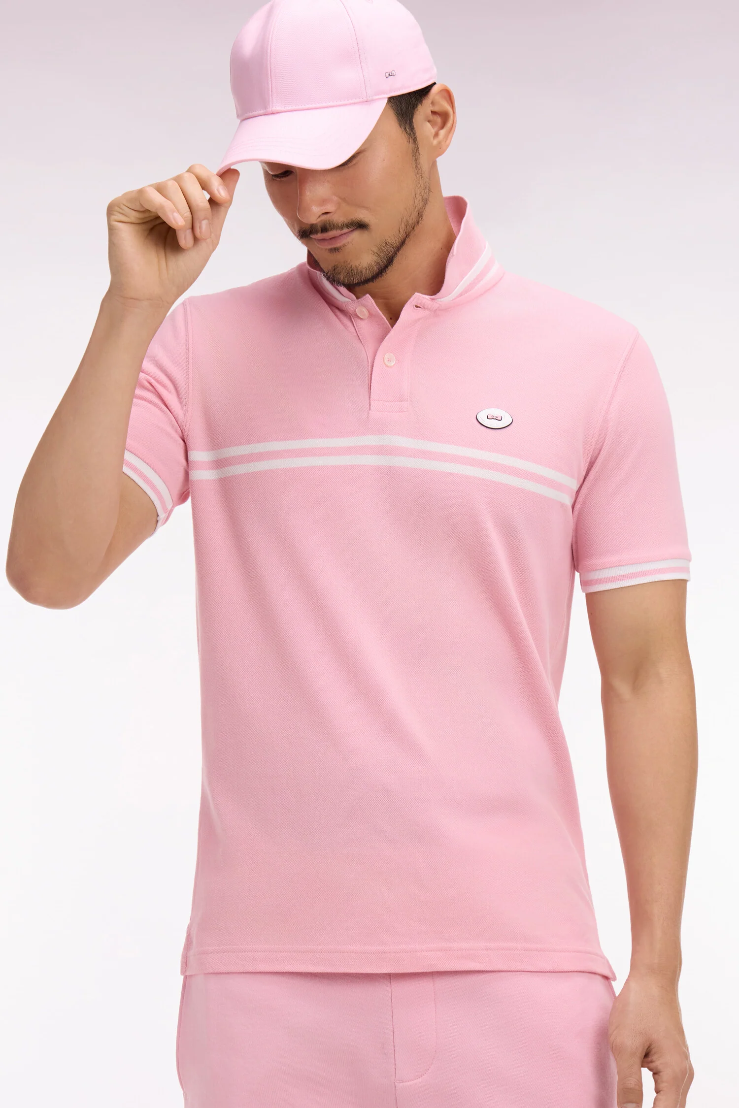 Polo à manches courtes en coton rose à rayures blanches coupe regular